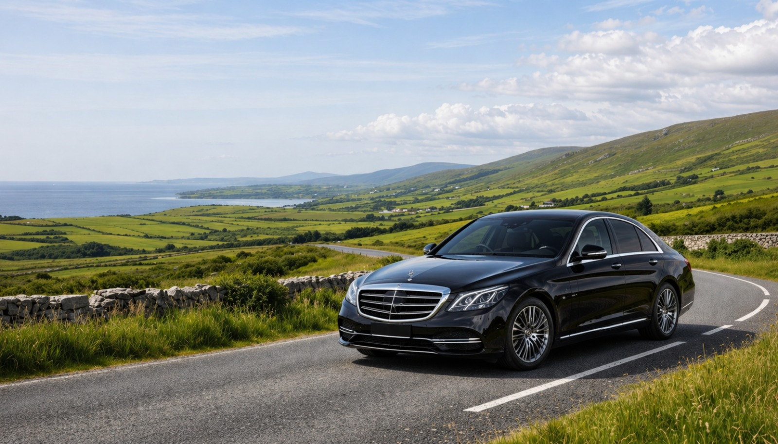 Black Mercedes S-Class chauffeur car on a scenic road in the west of Ireland
